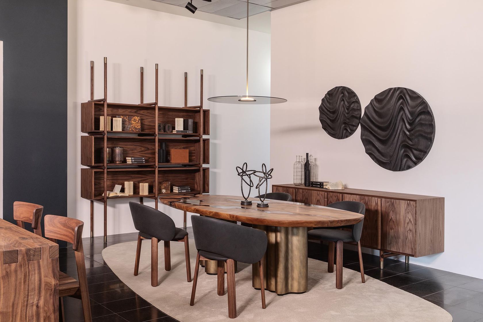 A Riva 1920 Kauri dining table with chairs and shelving in a styled interior, no people