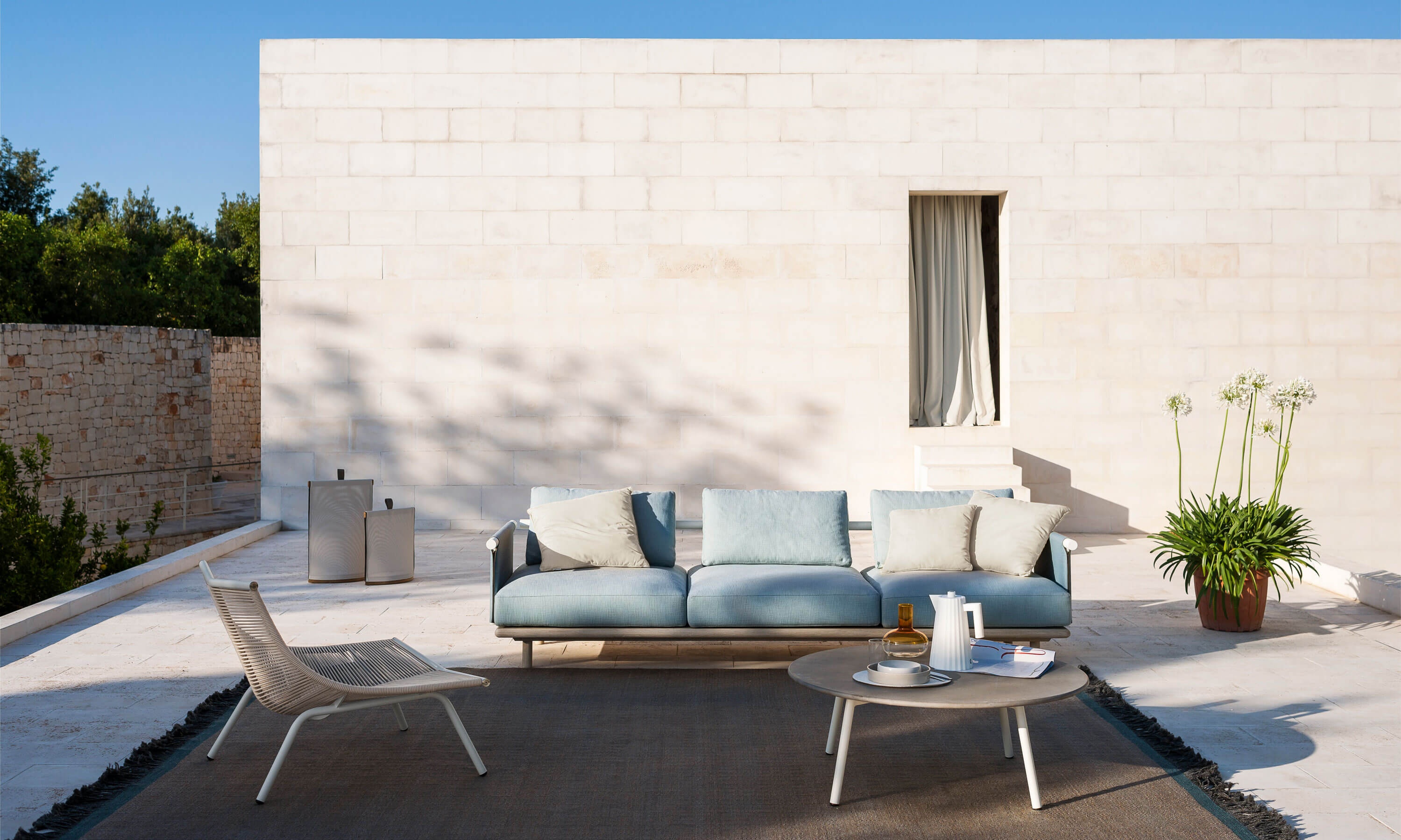 A premium European outdoor furniture setting on a terrace